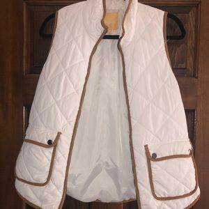 White vest with brown trim